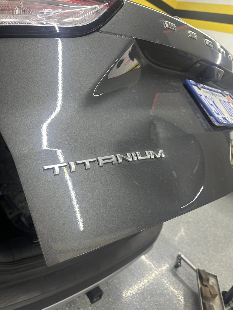 Dent in car lift gate