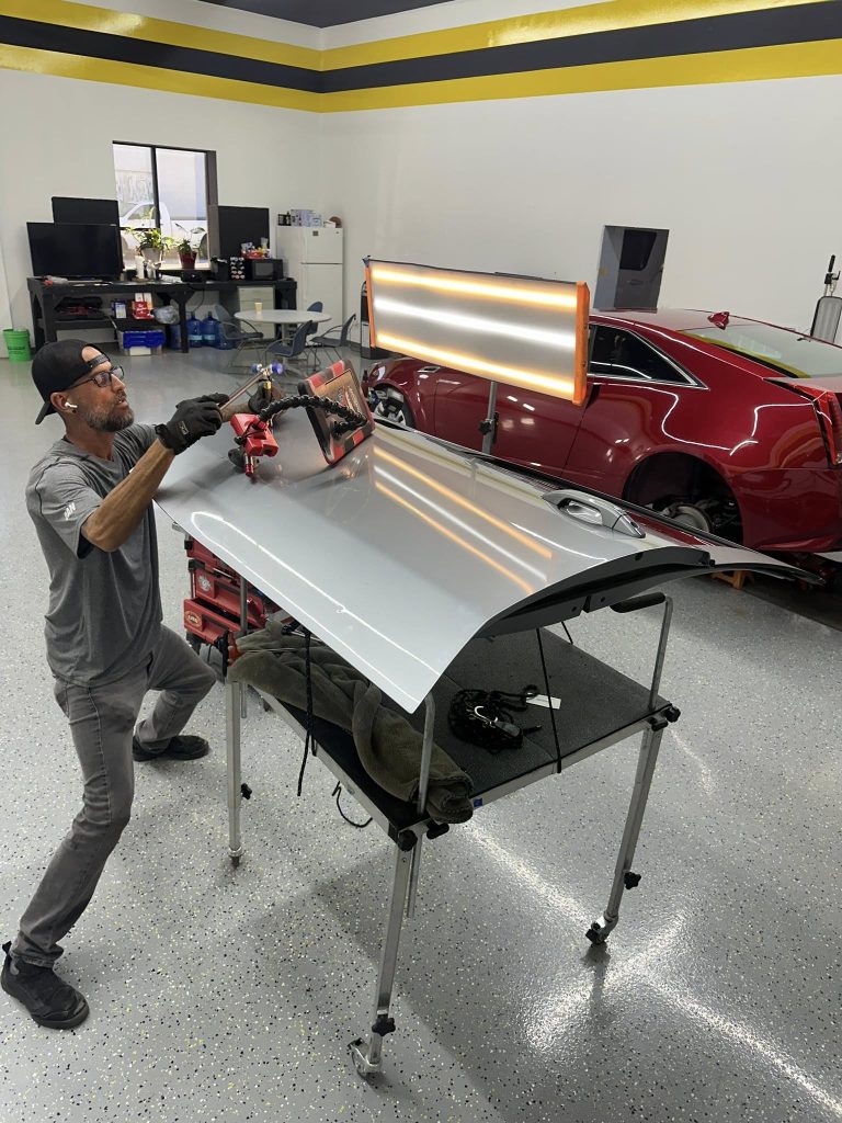 repair professional repairing dent